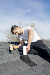 Roofer Repairing Leaks Around Vent Pipes On House Roof — URB’n Roofing In Gumdale, QLD